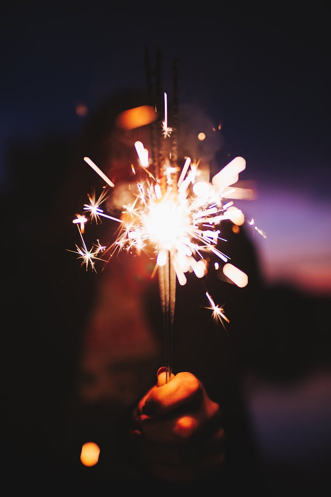 Vibrant sparkler lighting up the night, creating a festive atmosphere in São Paulo, Brazil.